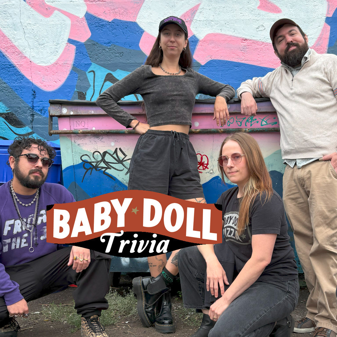 Four trivia hosts standing around a dumpster all cool