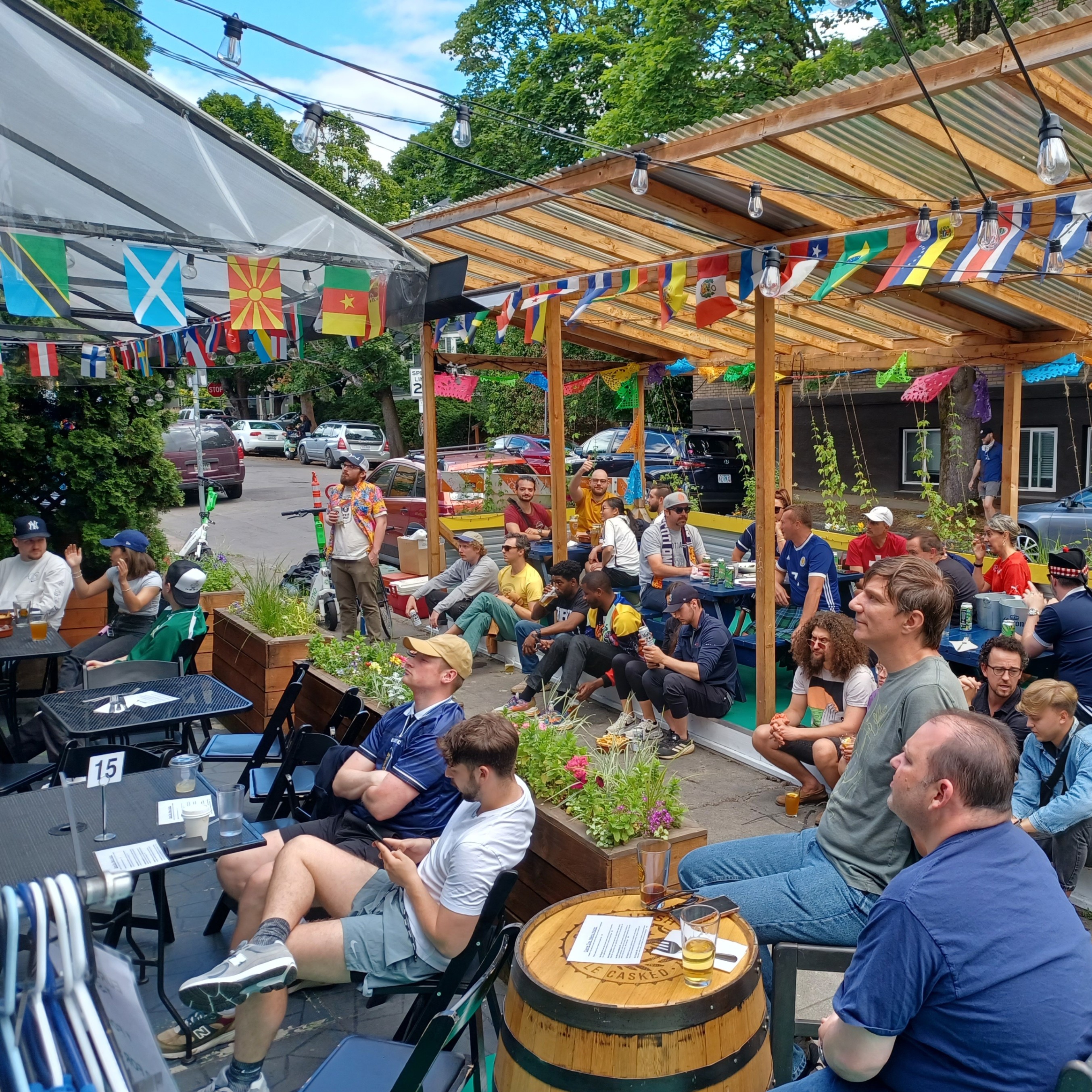 people on a patio watching sports