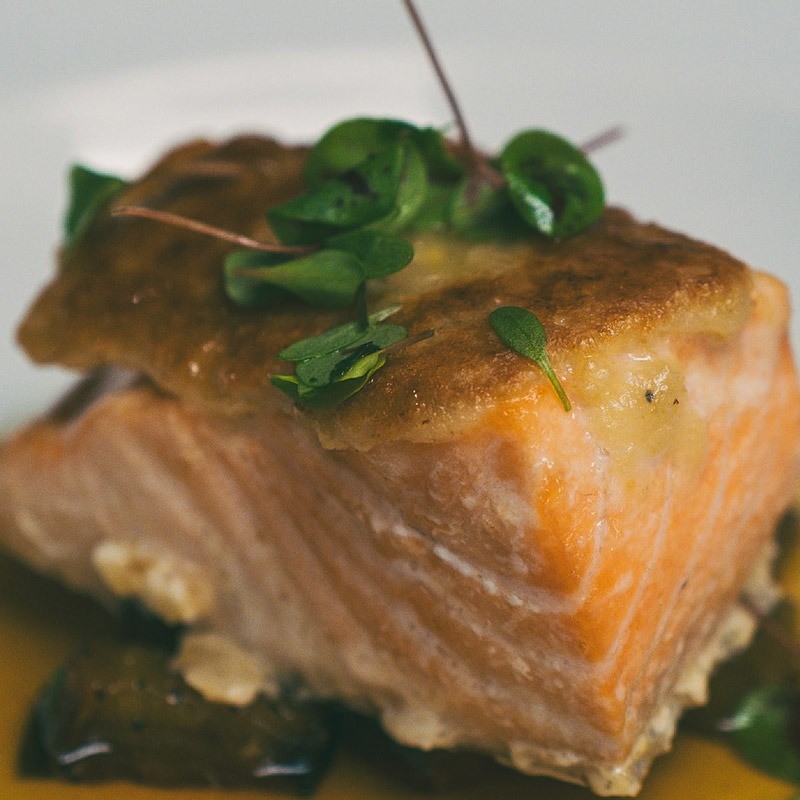 Pinon crusted salmon topped with micro greens.