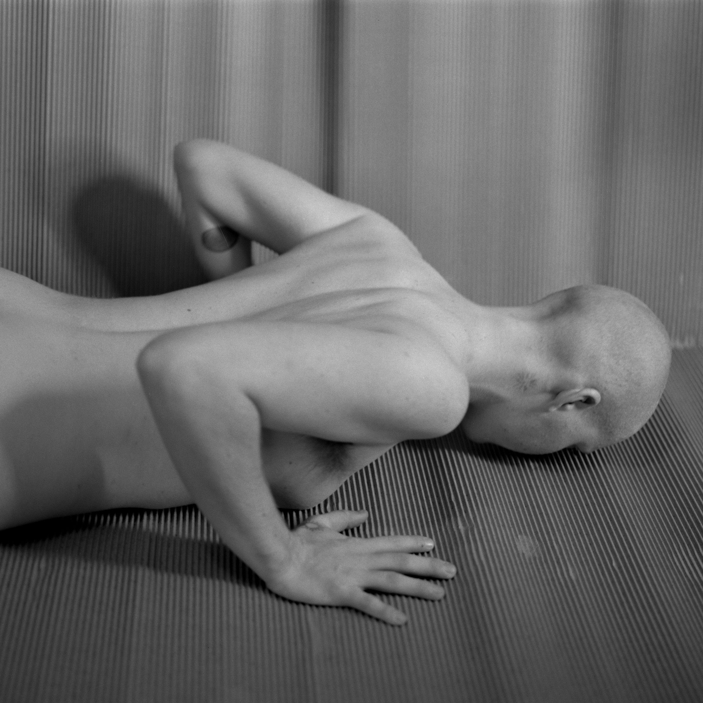 a person lying face-down on the ground