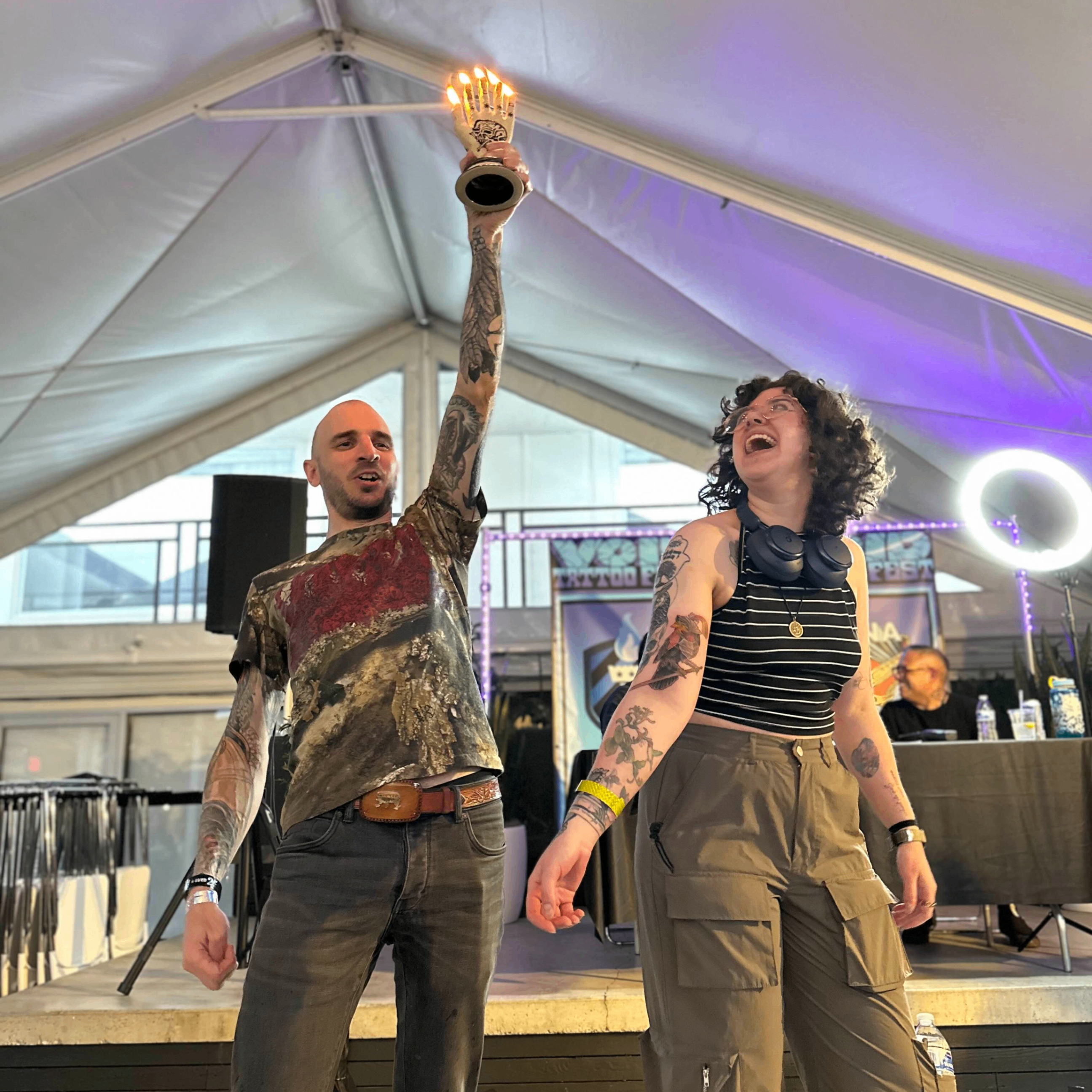 Winner! Tattooer and client being awarded for their tattoo.