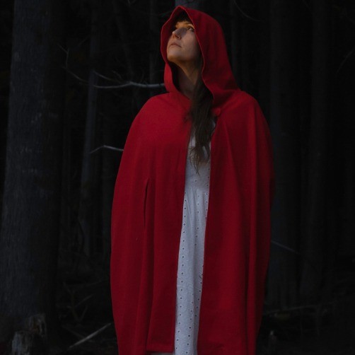 person in a red hooded cloak