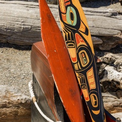 canoe paddles with indigenous designs painted on it