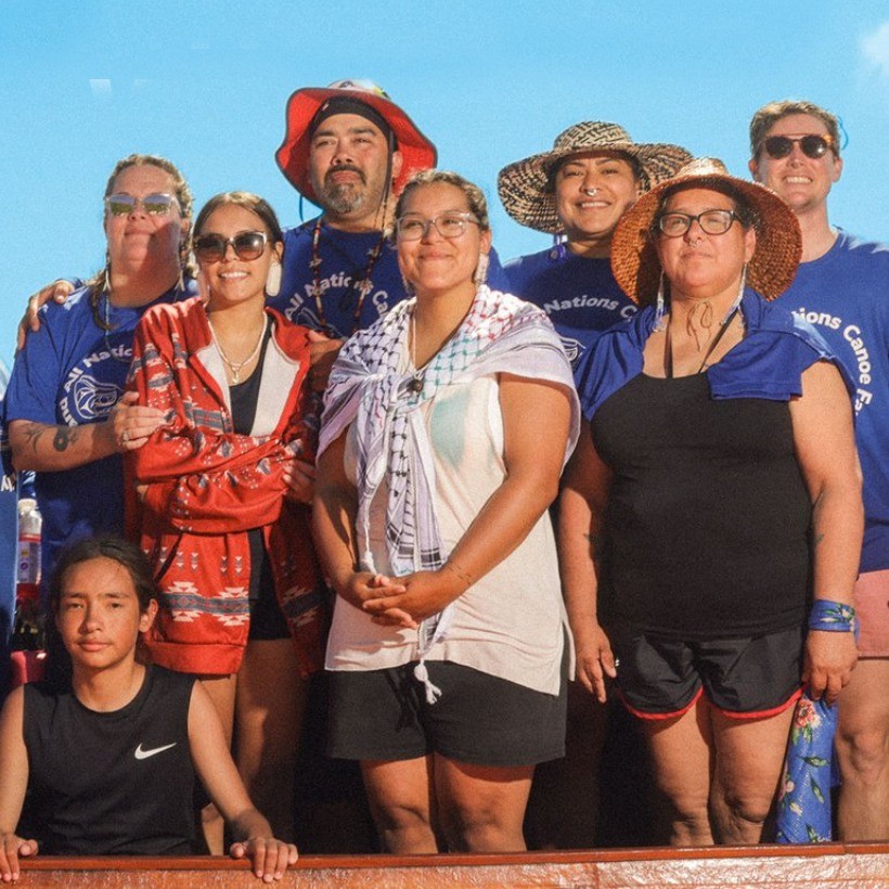 a group of people smiling at the camera