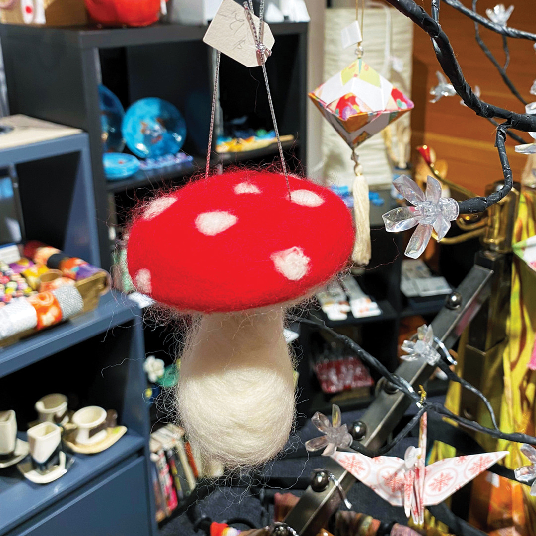 felted mushroom ornament on a tree