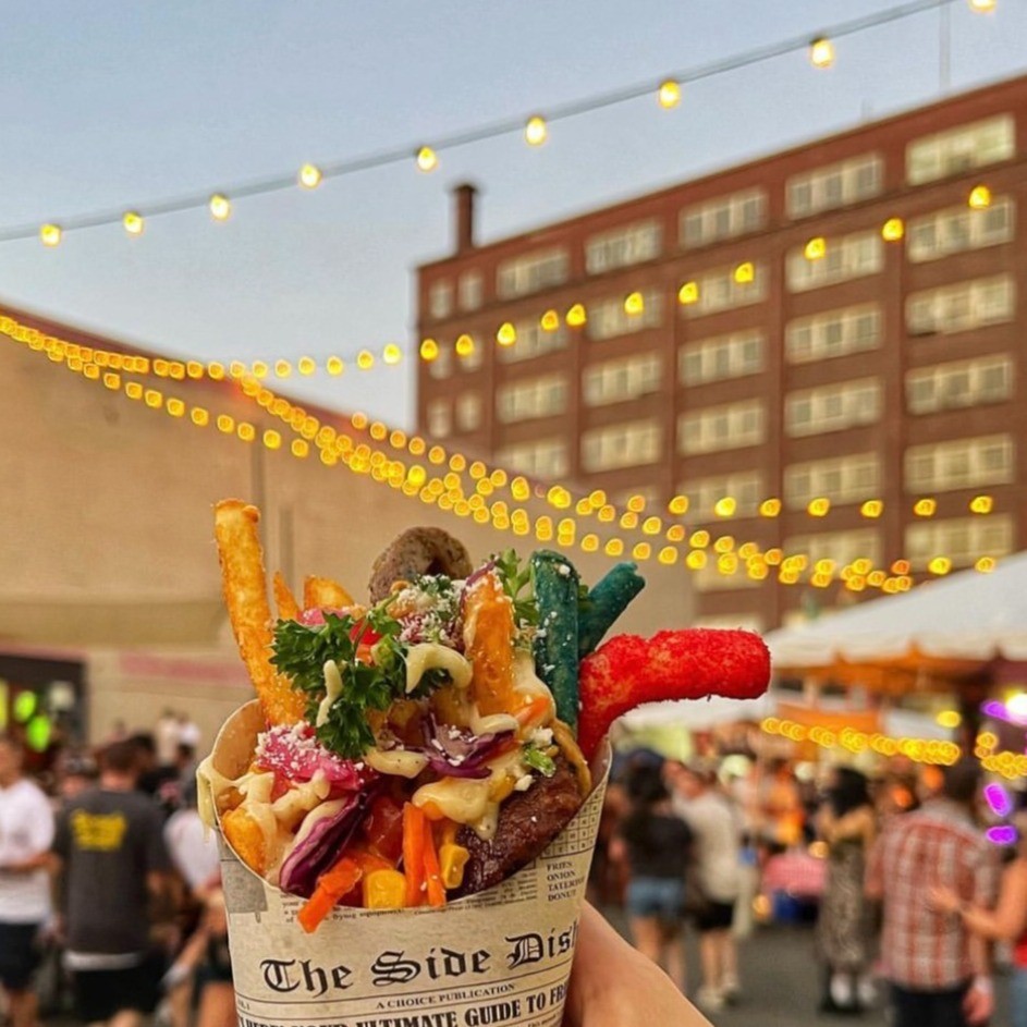 an image of fries with sauce and veggies