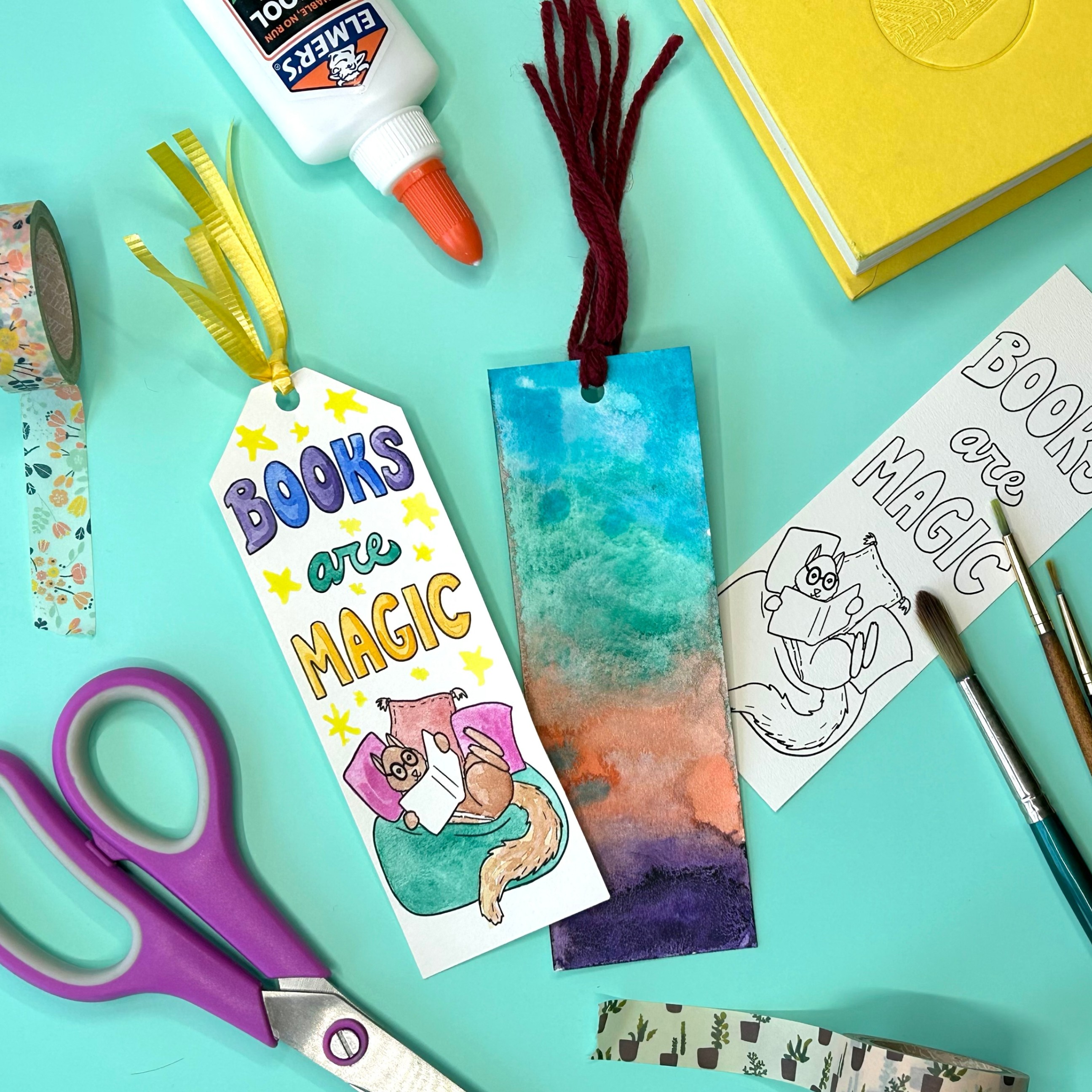 Image of crafting materials and handmade bookmarks that say Books Are Magic