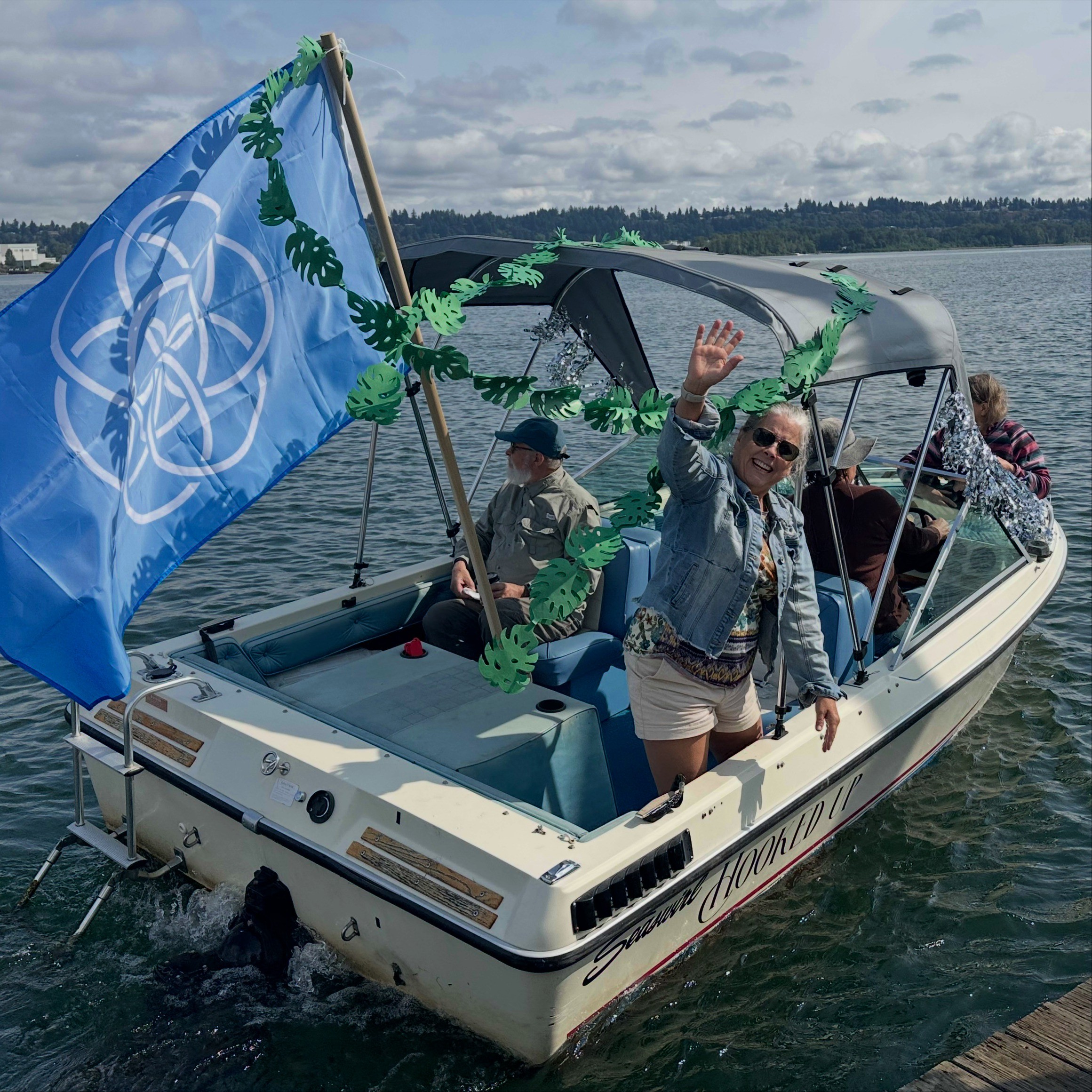 people on a boat waving