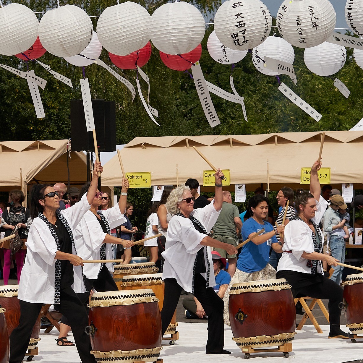 Taiko drummers performing on a stage