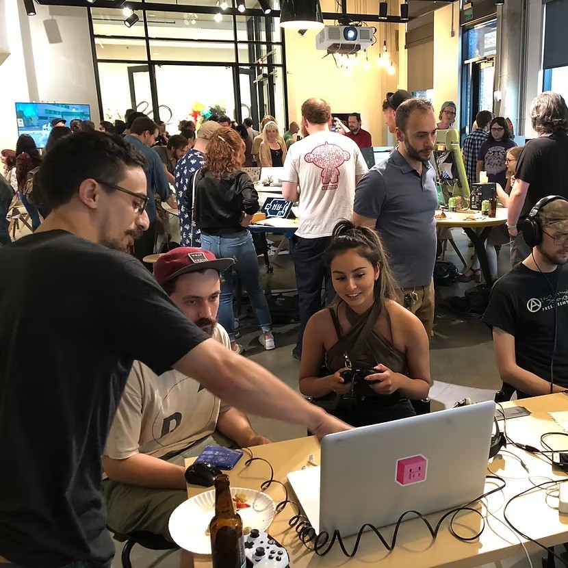 people at tables with computers in front of them