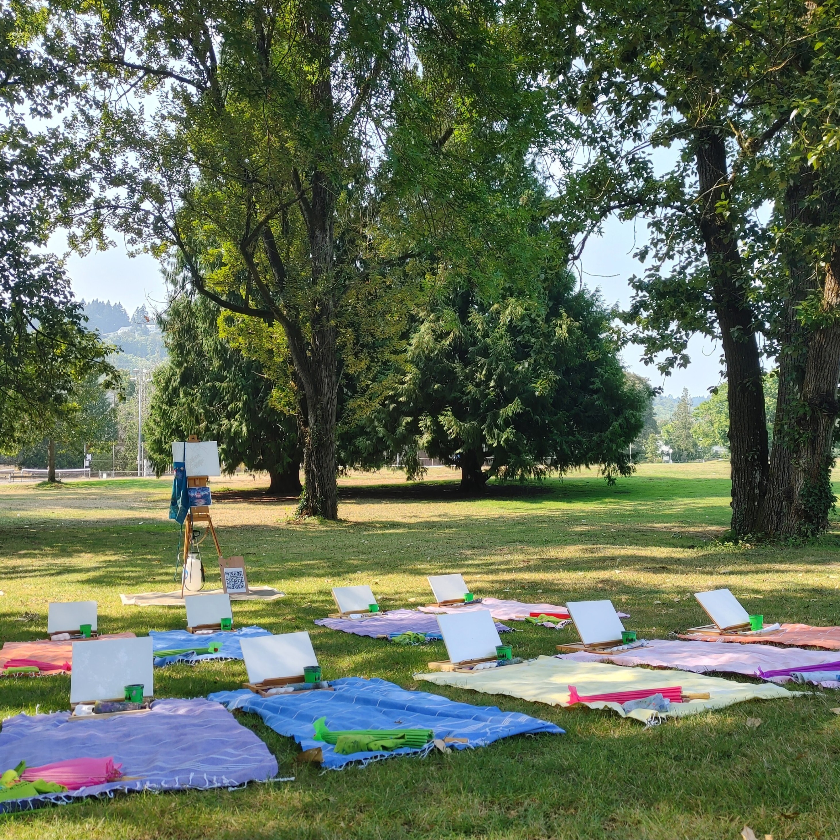 painting easels set up on blankets