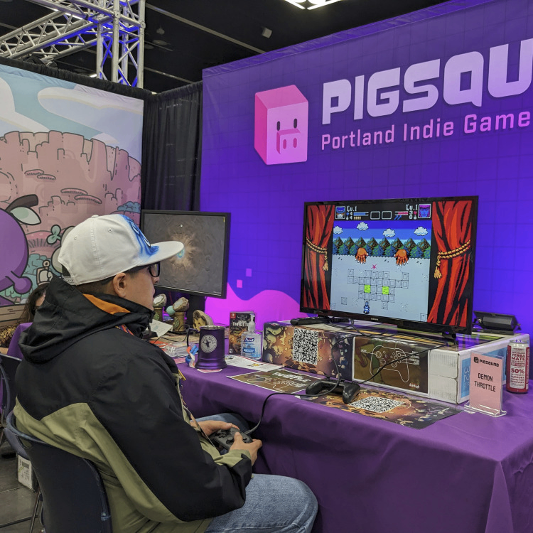 A photo of an attendee playing a game at a PIGSquad event