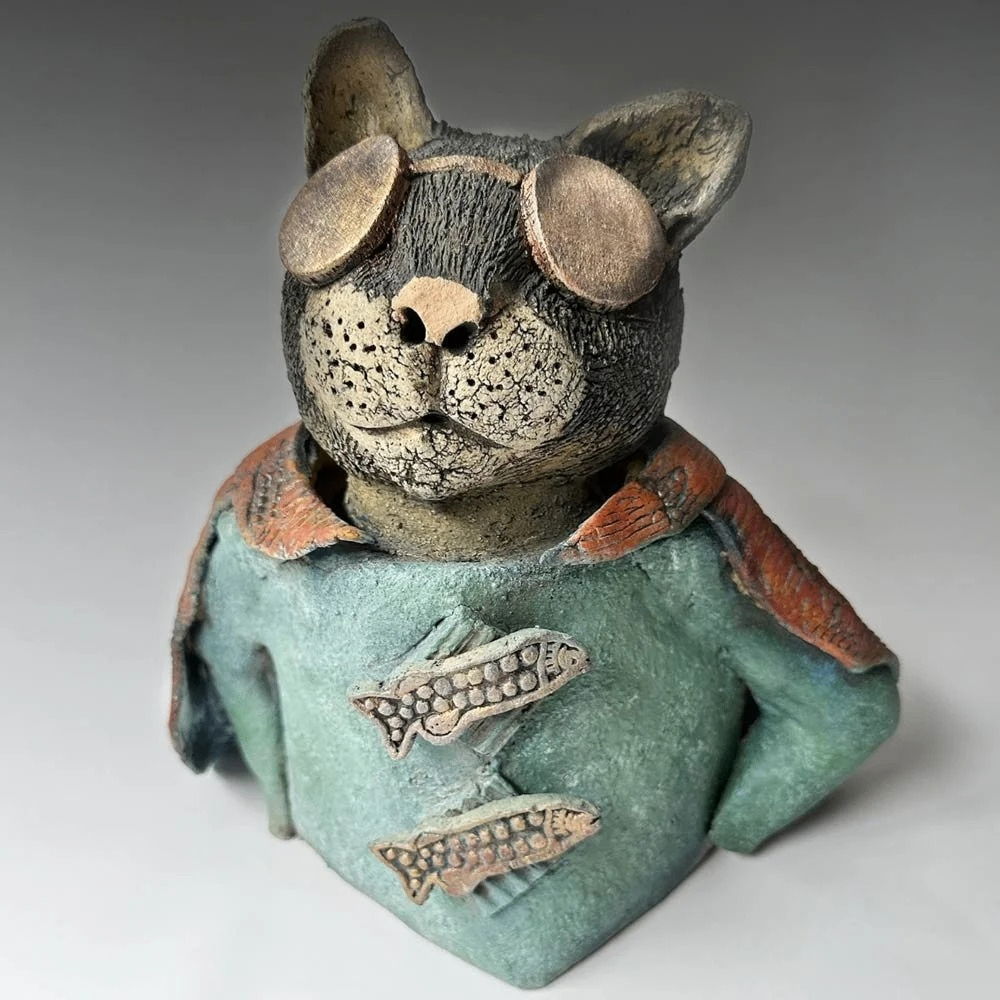a ceramic sculpture of a cat 