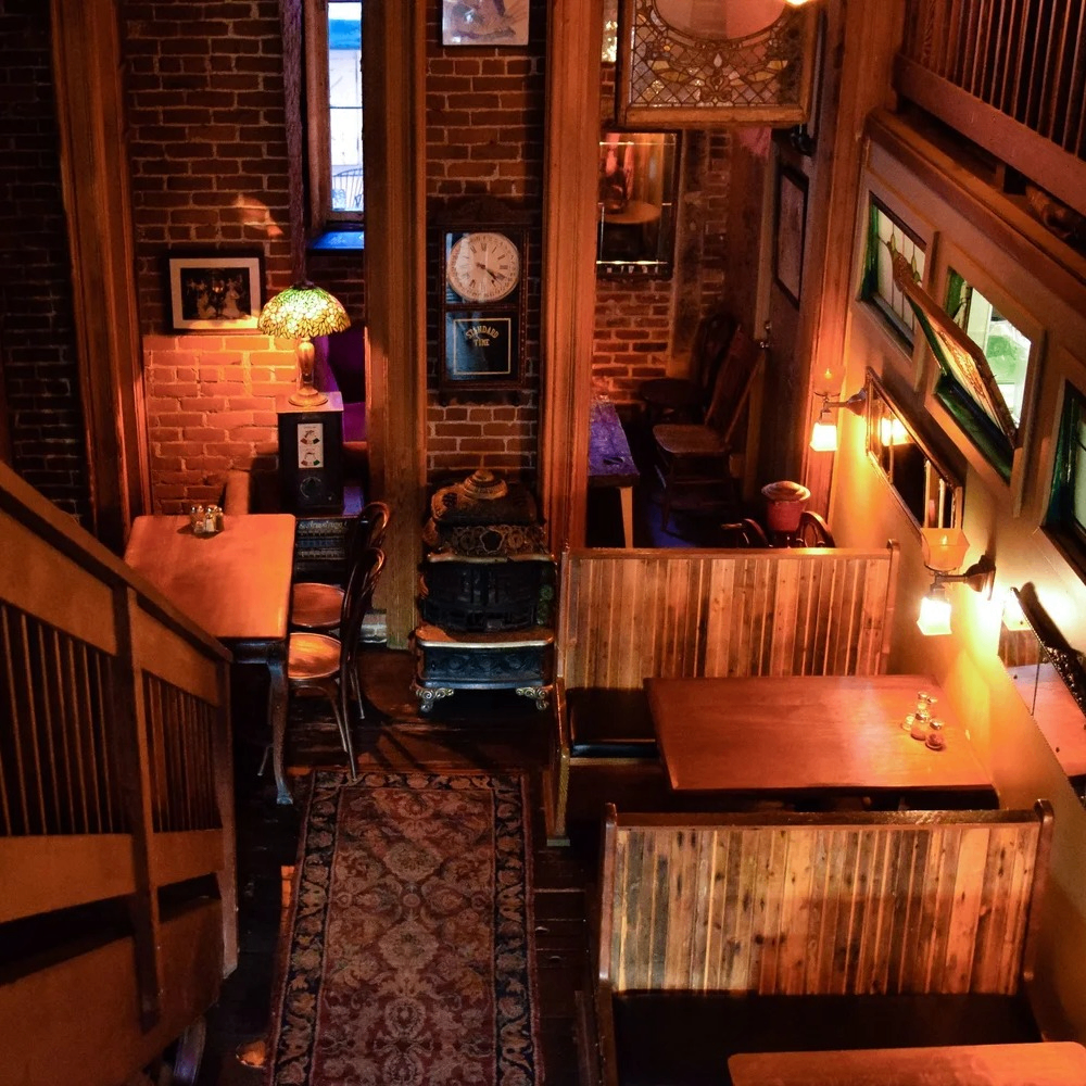 image of restaurant booths and brick wall