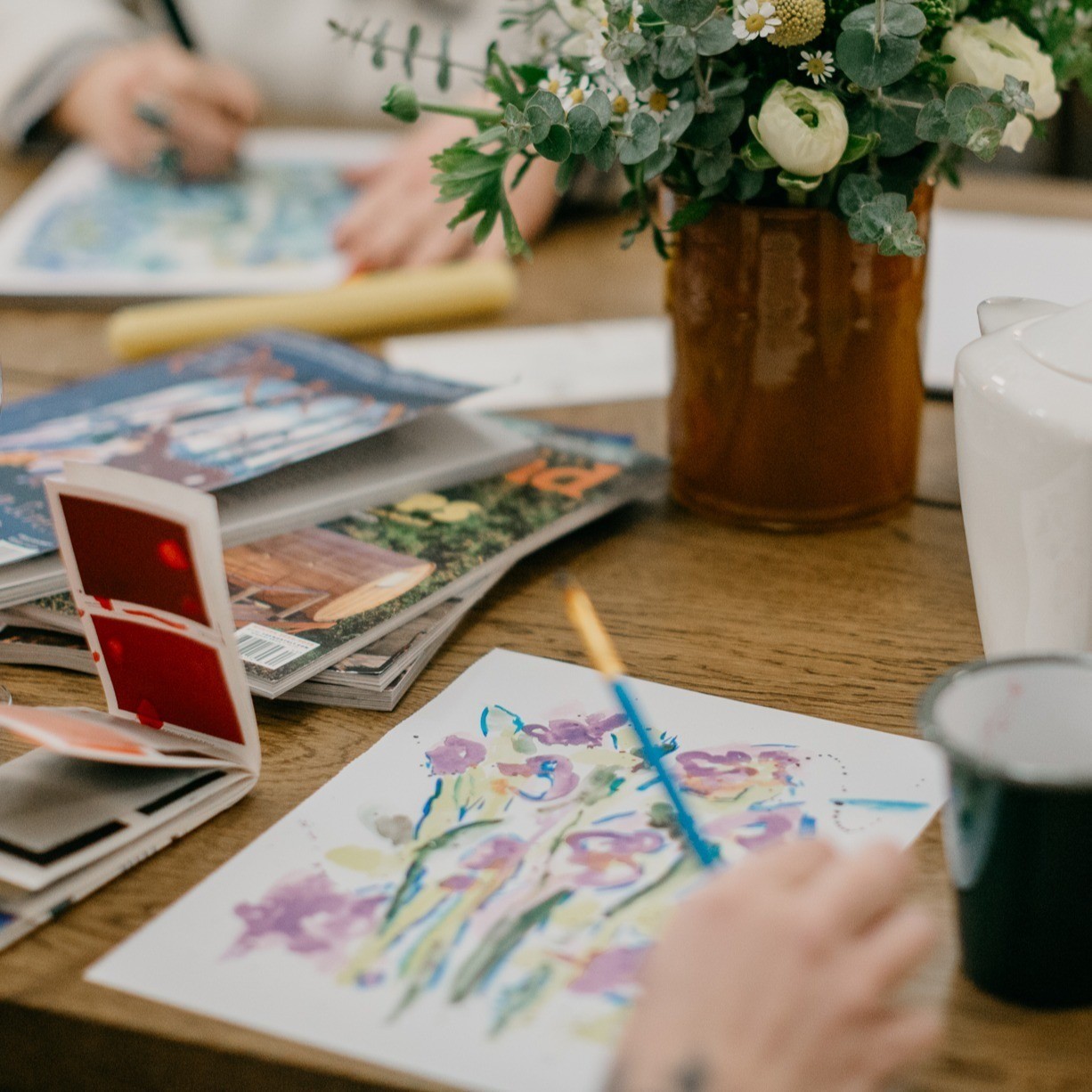 watercolor paintings on a table