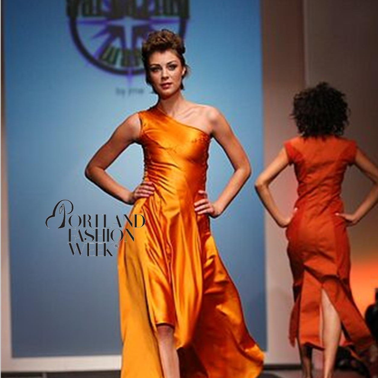 models in dresses walking on the runway