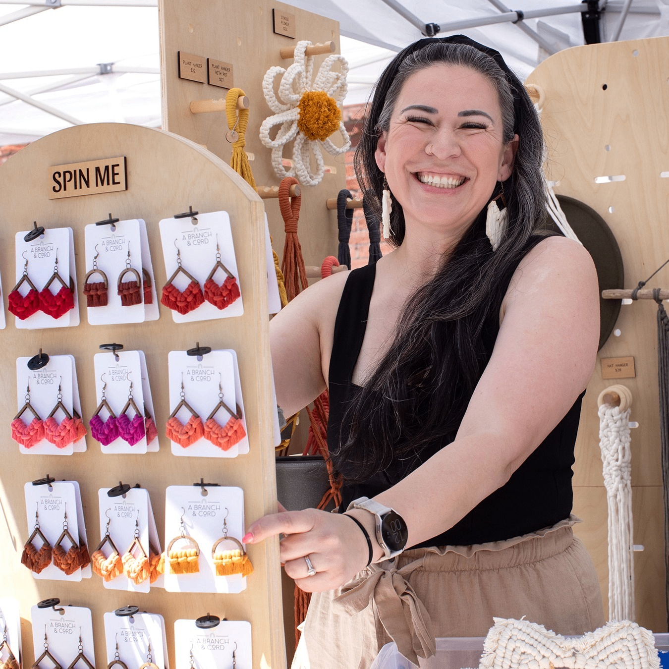 a person selling earrings in an outdoor market