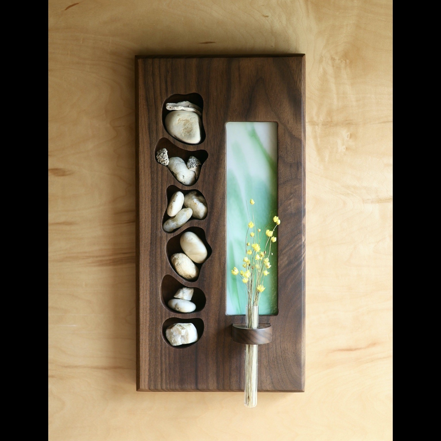 a wooden bud vase with stones inlayed