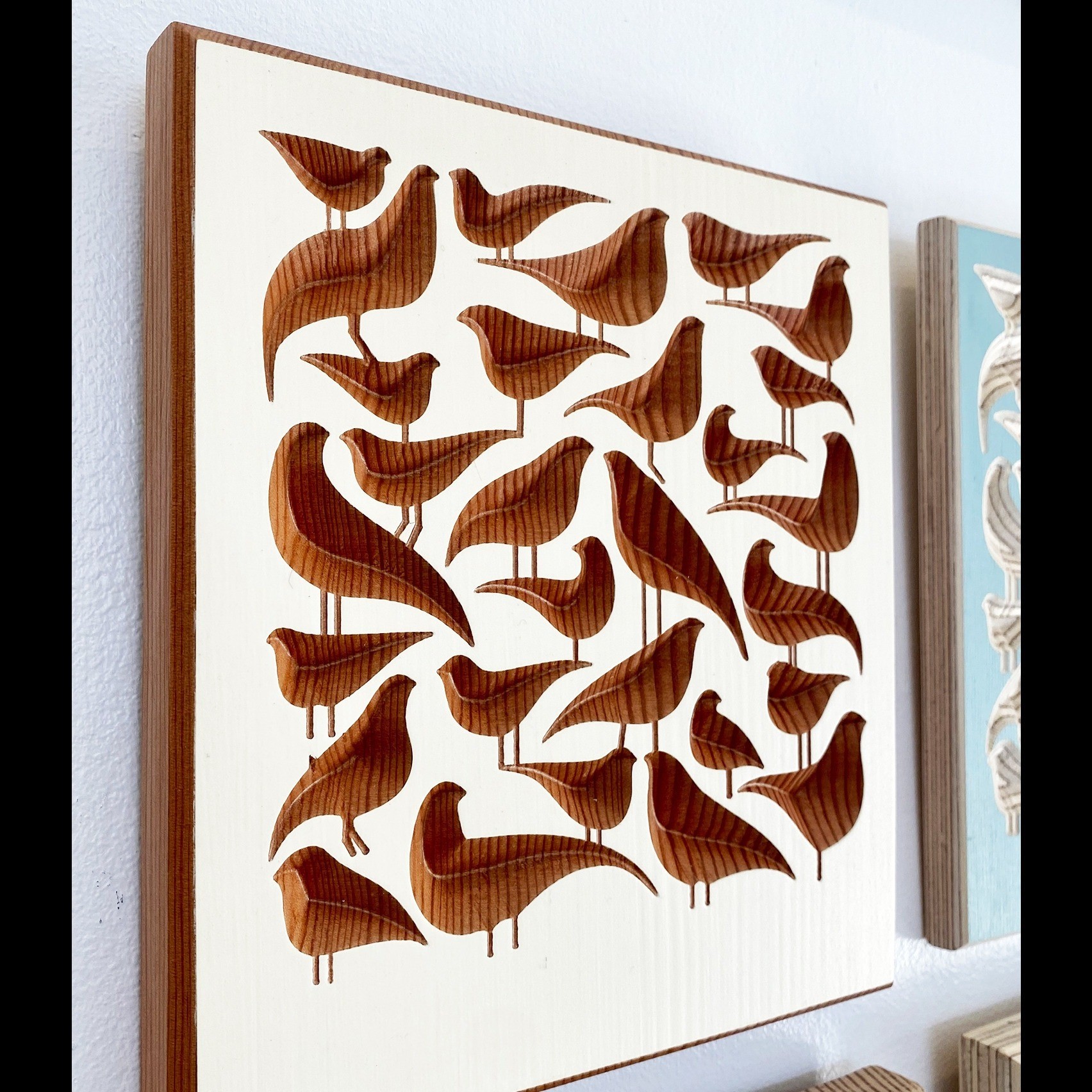 a print of wooden birds