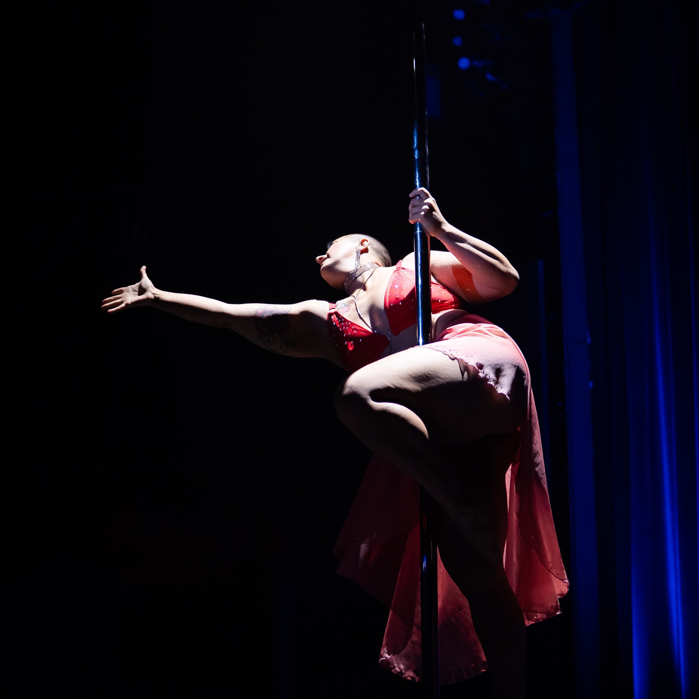 a person performs on a pole