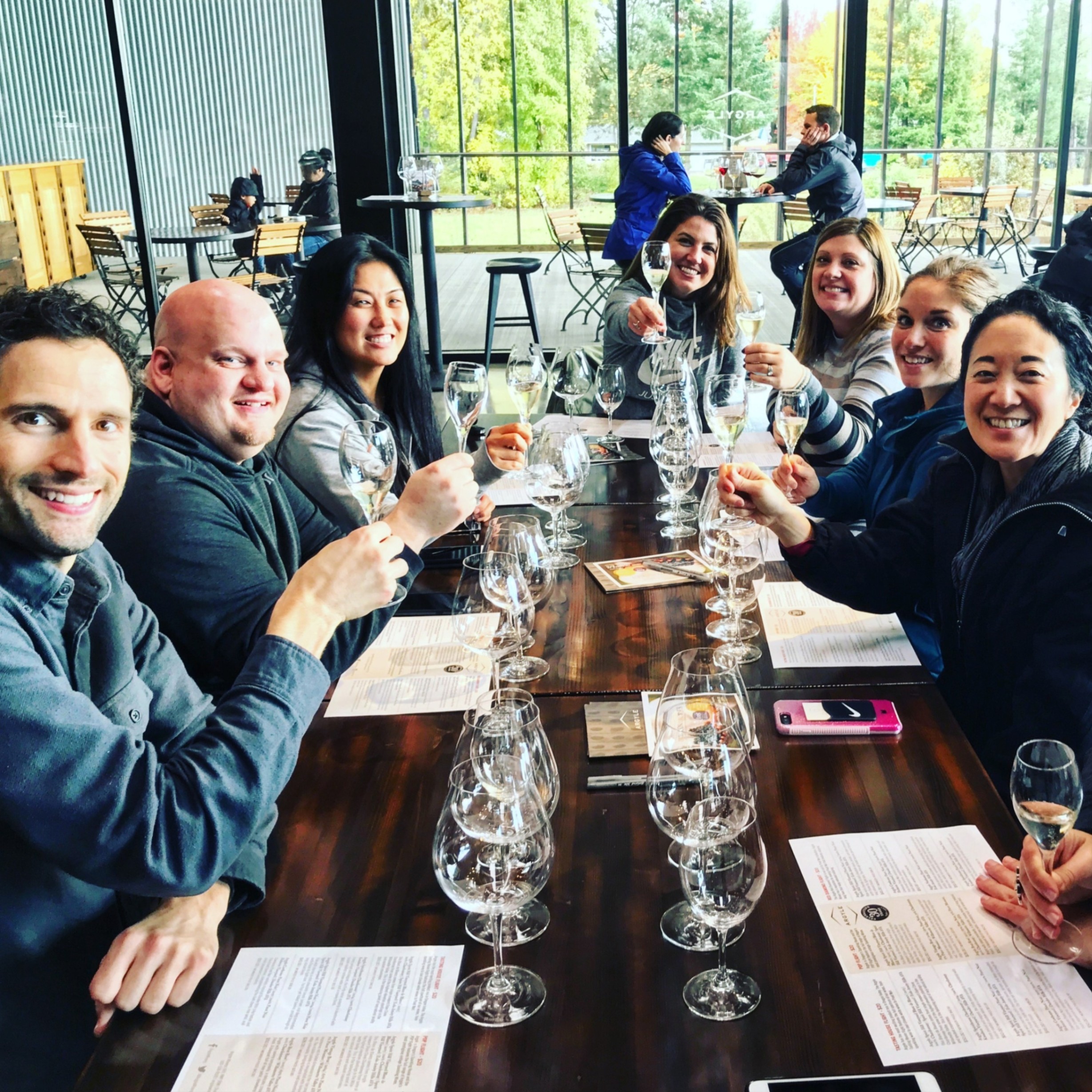 a table full of people at a winetasting