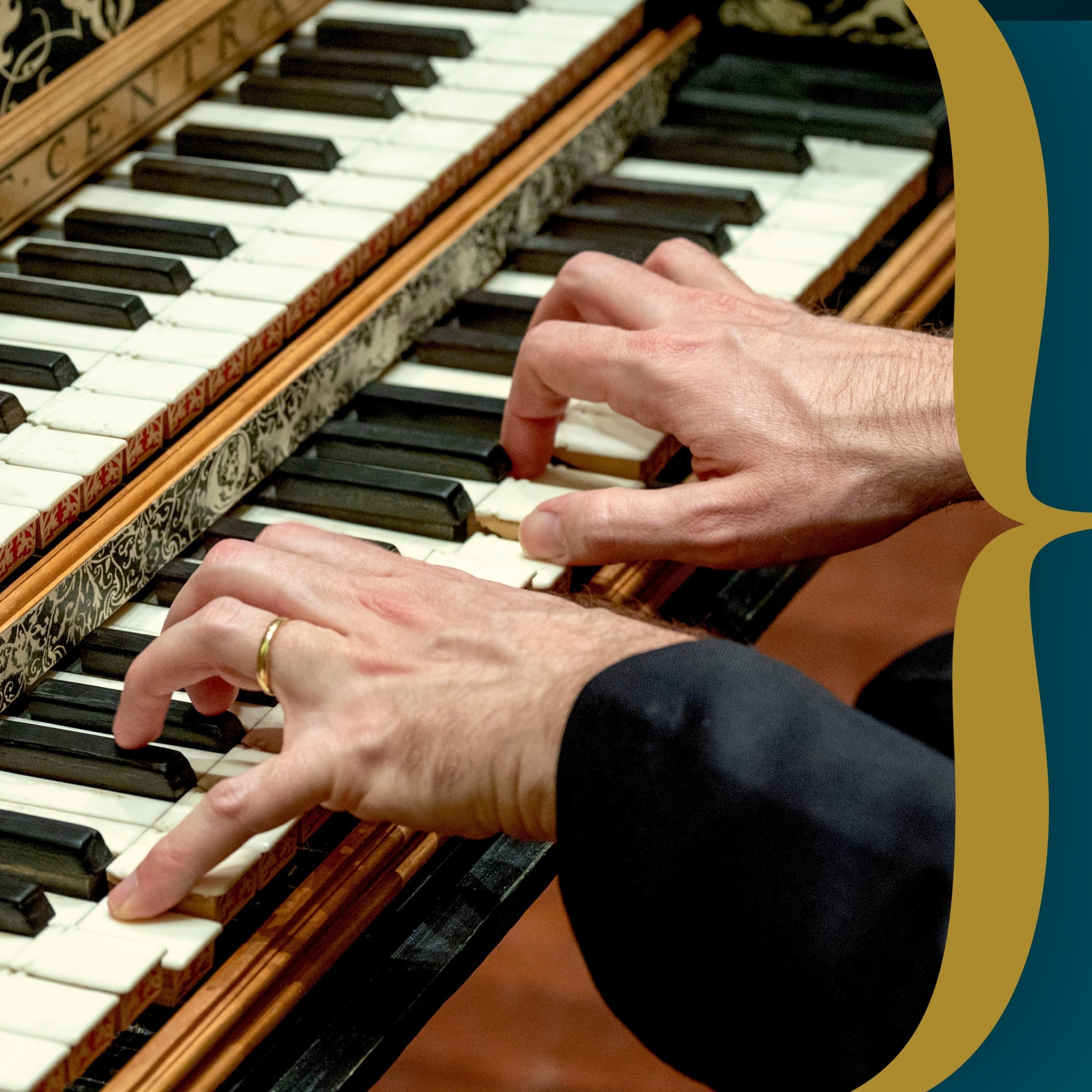 hands playing a two level organ