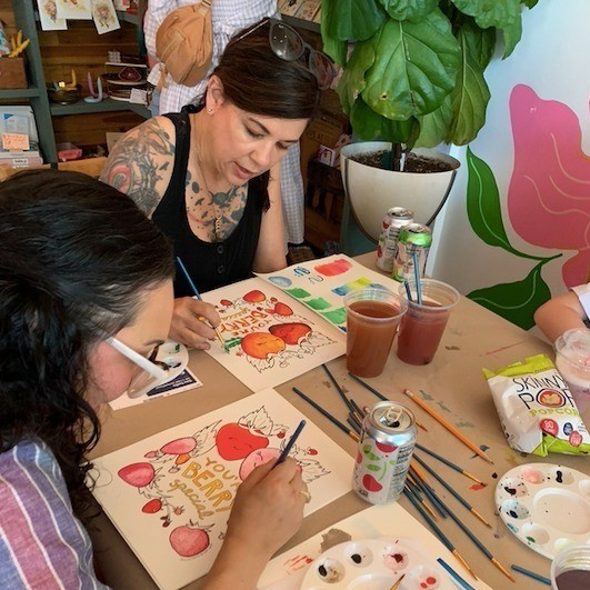 people painting with watercolor paint