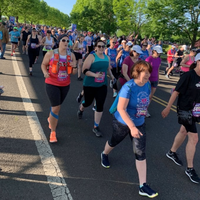 a large crowd of people running and walking in a marathon