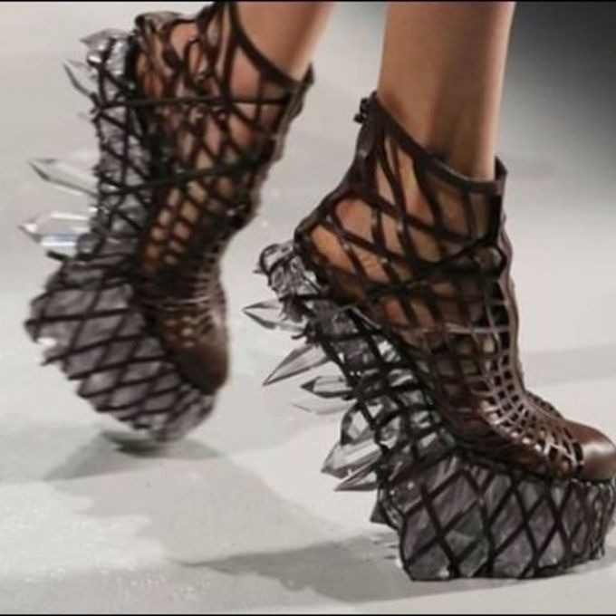 feet walking in high-heeled shoes with crystals on the sole